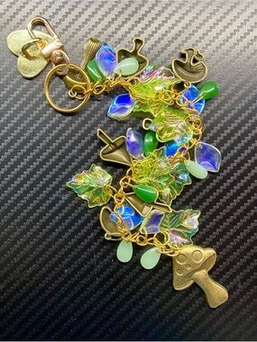 Gold-Tone Kindle Charms with Green and Iridescent Leaf Charms